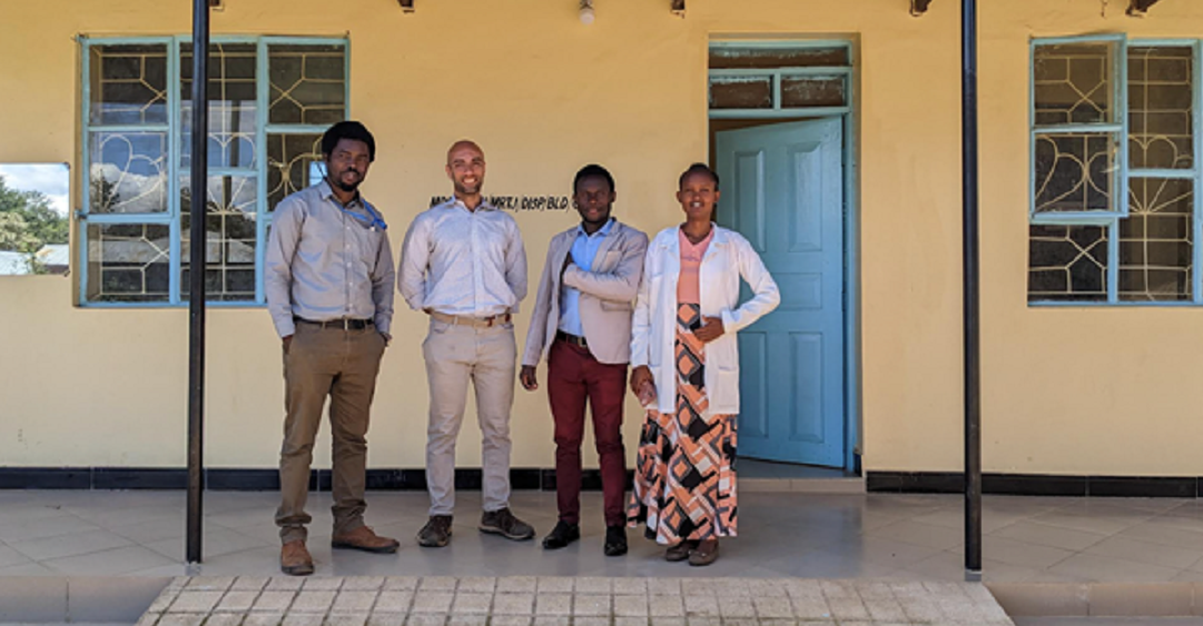 Dr. Ghassan Ilaiwy (second from left) is pictured with Dr. Saning'o Lukumay (far left) and staff at the Maretadu dispensary. 