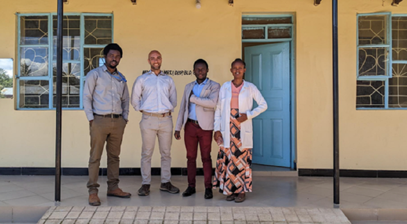 Dr. Ghassan Ilaiwy (second from left) is pictured with Dr. Saning'o Lukumay (far left) and staff at the Maretadu dispensary. 